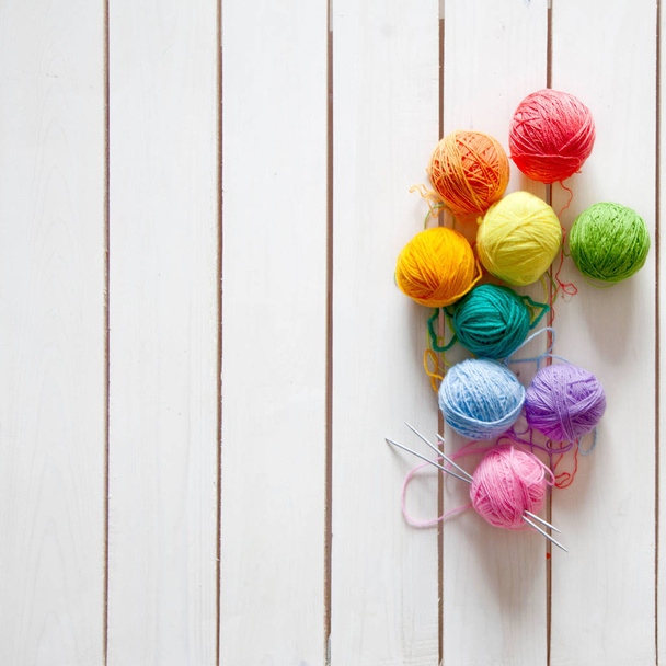 Balls of colored yarn. View from above. All the colors of the rainbow. Sample knit. Crochet. - Φωτογραφία, εικόνα