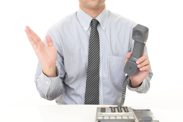 hombre de negocios con un teléfono - Foto, Imagen