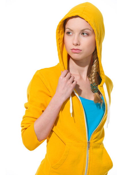 Modern teenager girl in sweater with draped hood looking on copy - Foto, imagen