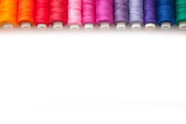 Color thread for sewing. White background. - Φωτογραφία, εικόνα