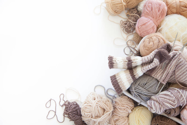 Neutral beige yarn for knitting is in the basket. Woolen warm so - Photo, image