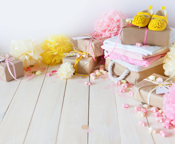 Gifts and pink decorations for girl baby shower indoors.  - Fotó, kép