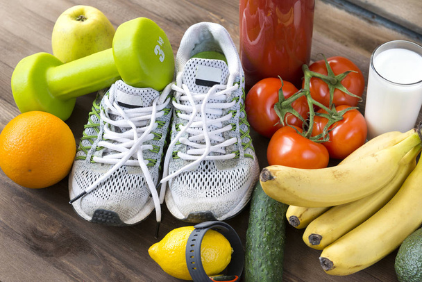 sneakers ,oranges, tomatoes, Apple, pear ,lemon, sports bracelet - Zdjęcie, obraz
