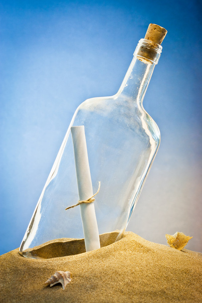 message in bottle on sand - Фото, зображення