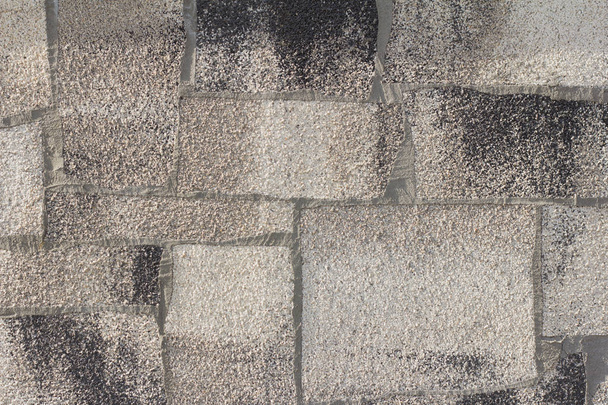 background, texture of concrete wall decorated with small stones - Photo, Image