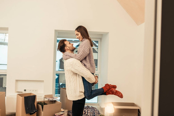 Couple feeling memorable having first night in new house - Photo, Image