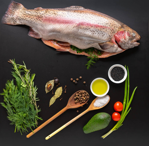 Fresh uncooked whole trout with seasonings - Fotografie, Obrázek
