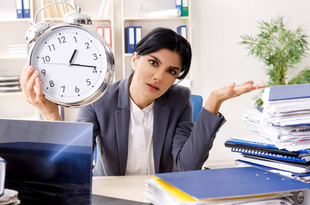 Middle aged businesslady unhappy with excessive work - Photo, Image