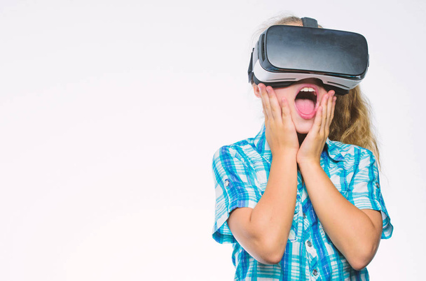 Small kid use modern technology virtual reality. Virtual education for school pupil. Get virtual experience. Virtual reality concept. Girl cute child with head mounted display on white background - Zdjęcie, obraz