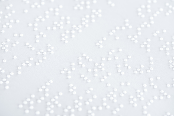 achtergrond voor tekst in internationale braille code op wit papier - Foto, afbeelding