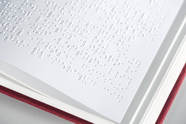 close up view of book with braille text isolated on grey - Photo, Image
