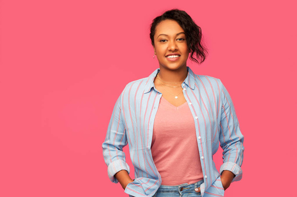 happy african american woman over pink background - Photo, Image