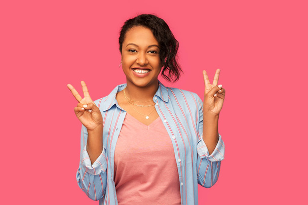 happy african american woman showing peace - Фото, изображение
