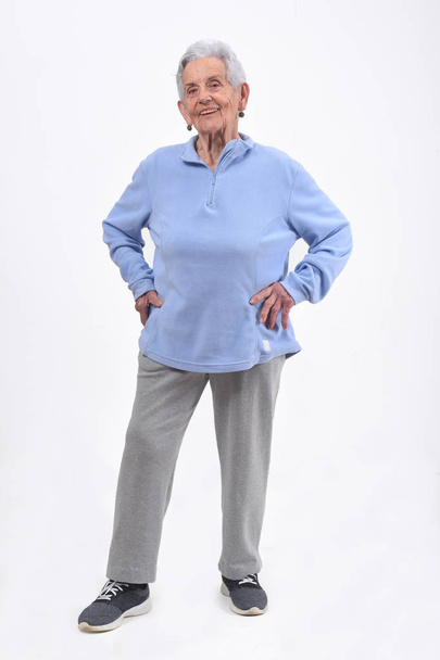 portrait of senior woman with sportsweare on white background - Photo, image