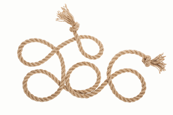 uzun kahverengi jüt halat knot ve üzerinde beyaz izole bukleler  - Fotoğraf, Görsel