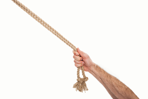 abgeschnittene Ansicht eines Mannes mit braunen Seilen in der Hand, isoliert auf weiß  - Foto, Bild