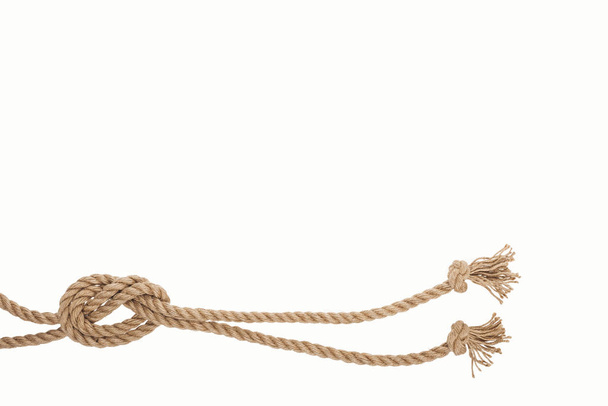 nautical brown and twisted ropes with sea knot isolated on white  - Foto, afbeelding