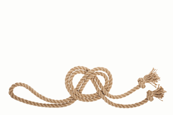 nautical brown and twisted rope with sea knot isolated on white  - Zdjęcie, obraz