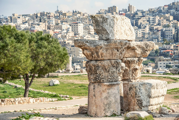 remnants of the columns and elements of the ancient temple on the top of the hill in Amman citadel - Photo, Image
