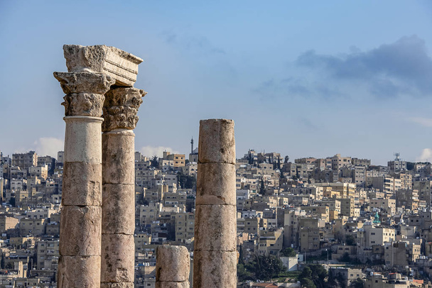 Ruins of the Temple of Hercules on the top of the mountain of the Amman citadel with a view of the ancient Middle Eastern city - Photo, Image