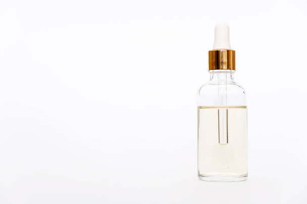 Dropper glass Bottle Mock Up. Cosmetic pipette on white background - 写真・画像