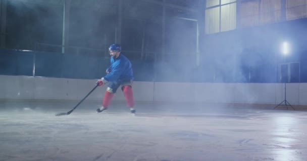 Hockey player carries out an attack on the opponents goal and scores a goal in extra time. The player brings victory to his team in shootouts - Footage, Video