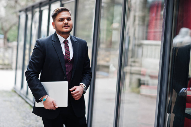 Stylish indian businessman in formal wear with laptop on hands s - Φωτογραφία, εικόνα