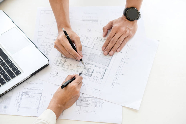 Close-up Of Person's engineer Hand Drawing Plan On Blue Print wi - Photo, Image
