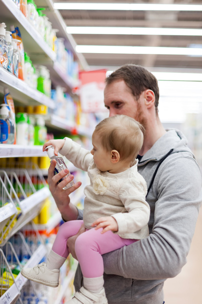 young father with   small baby shopping at  supermarket. - Фото, изображение