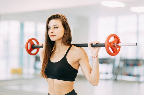 Beautiful girl in the gym. Sports and fitness, healthy lifestyle. - Fotoğraf, Görsel