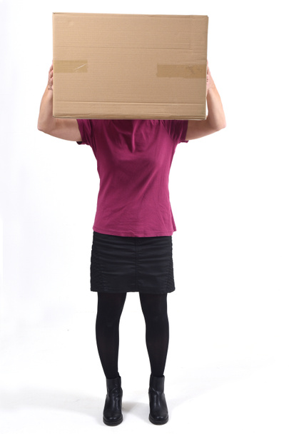 woman with a package in front of her face - Foto, Bild