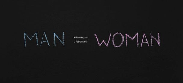 Word Man is equal Woman, chalkboard sketch - Photo, Image