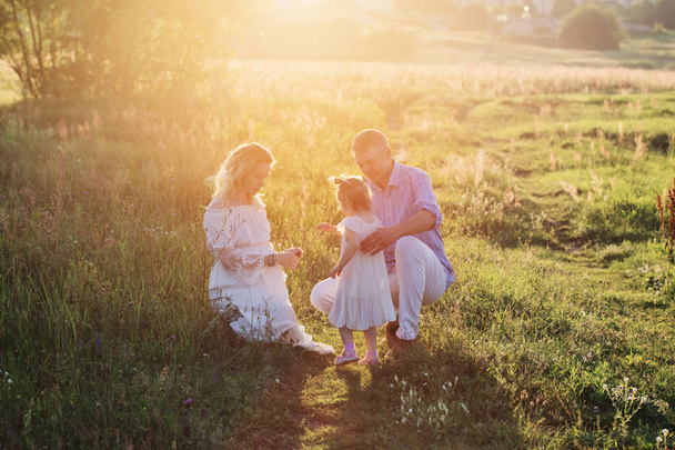 happy family in summer park at sunset - 写真・画像