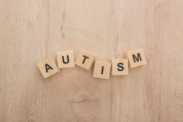 top view of autism lettering made of wooden blocks  - Foto, Imagen