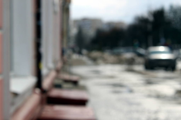blurred background of gray city street in sunny day - Фото, зображення