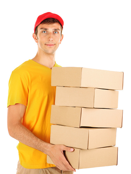 Young delivery man holding parcels, isolated on white - Photo, Image