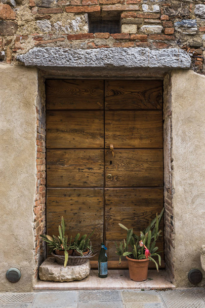 Architectural detail of street house door of window of San Casciano dei Bagni, Siena, Tuscany, Italy - Fotó, kép
