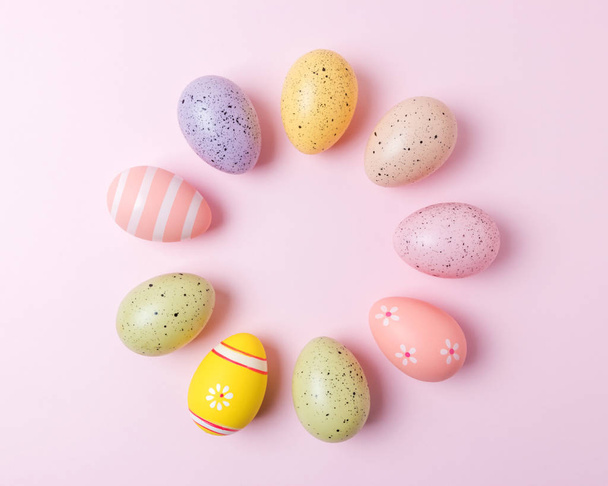 Colorful Easter eggs on pink background. Minimal Easter concept. - Valokuva, kuva