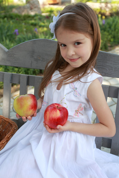 Portrait of lovely girls with red apples - Photo, image