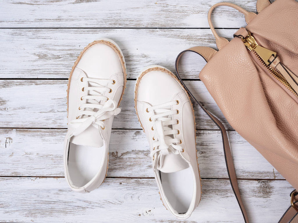 Womens shoes, accessories (white leather sneakers, beige backpac - Photo, Image