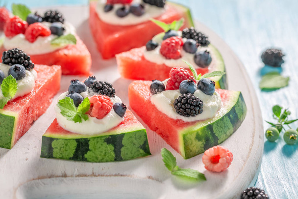 Delicious watermelon pizza with blueberries, raspberries and cream - Fotografie, Obrázek