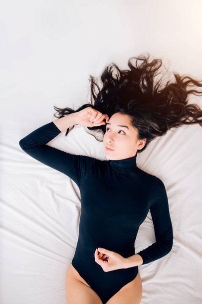 Portrait pretty sexy young woman on bed - 写真・画像