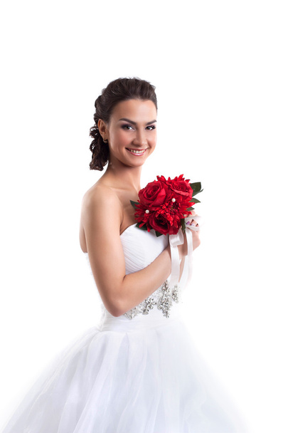 Portrait of smiling bride posing with bouquet - Фото, зображення