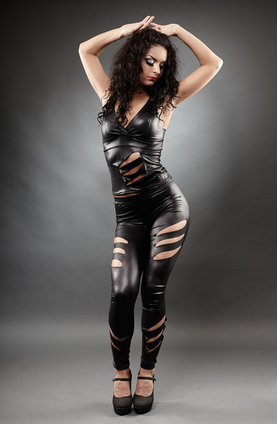Sexy woman posing in leather suit - Fotoğraf, Görsel