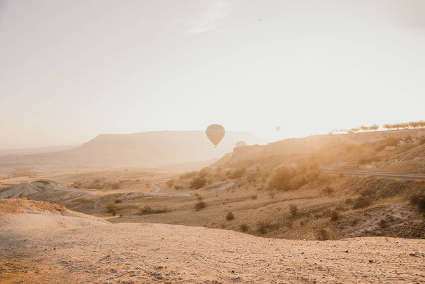 Dawn in Cappadocia on the background of balloons - Fotoğraf, Görsel
