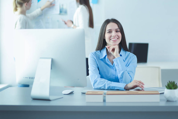 Attractive business woman working on laptop at office. Business people - Photo, Image