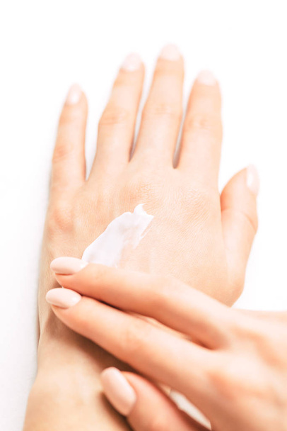 Woman's hands applying moisturizing cream.  - Zdjęcie, obraz