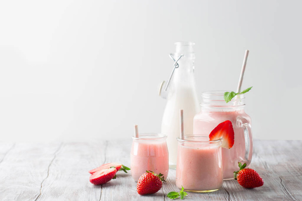 Detox diet concept: strawberry smoothie on table - 写真・画像
