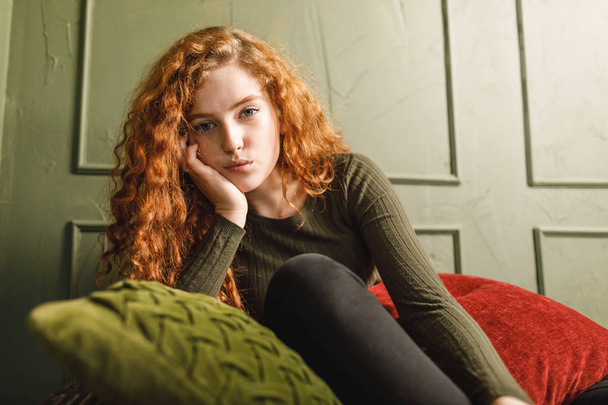 Ginger Girl Sitting at the Sofa - Photo, Image