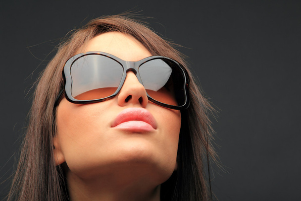 beautiful long hair brunette woman wearing sunglasses - Fotó, kép